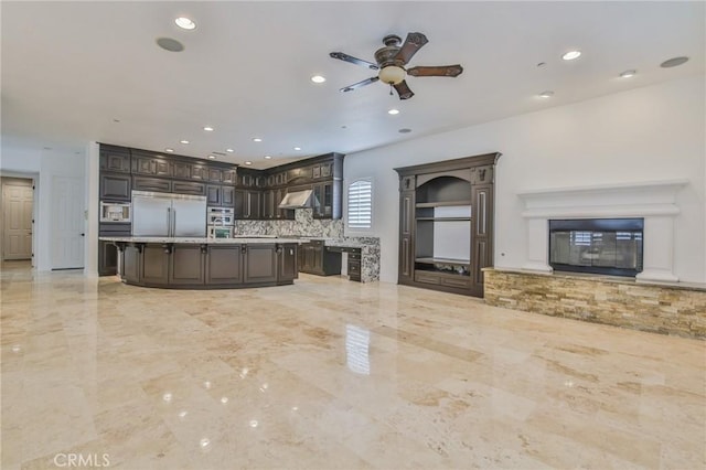 12932 Carnesi Dr, Rancho Cucamonga, CA 91739 - unfurnished living room with a glass covered fireplace, a ceiling fan, recessed lighting, and light marble finish floors