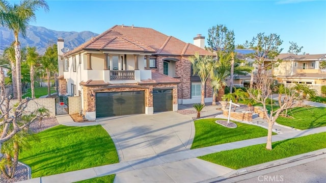 12932 Carnesi Dr, Rancho Cucamonga, CA 91739 - mediterranean / spanish-style house with a chimney, an attached garage, a balcony, and driveway