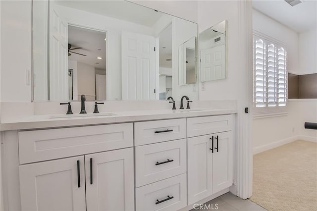 12932 Carnesi Dr, Rancho Cucamonga, CA 91739 - full bath with double vanity, baseboards, a ceiling fan, and recessed lighting