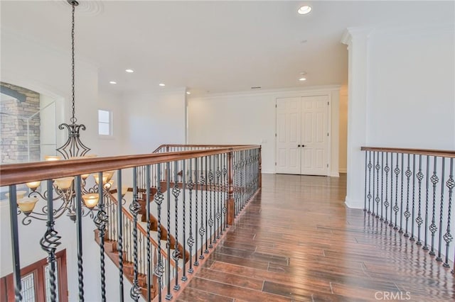 12932 Carnesi Dr, Rancho Cucamonga, CA 91739 - hallway featuring wood finished floors, ornamental molding, recessed lighting, an upstairs landing, and baseboards
