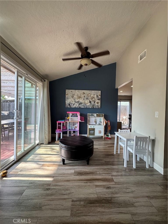 3542 Ponderosa Dr, Oceanside, CA 92058 - living room featuring lofted ceiling, a textured ceiling, ceiling fan, and wood finished floors