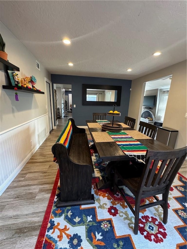 3542 Ponderosa Dr, Oceanside, CA 92058 - dining space with wood finished floors, a textured ceiling, recessed lighting, and wainscoting