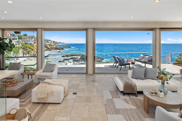 1907 Ocean Way, Laguna Beach, CA 92651 - living area with stone tile flooring, a water view, and recessed lighting