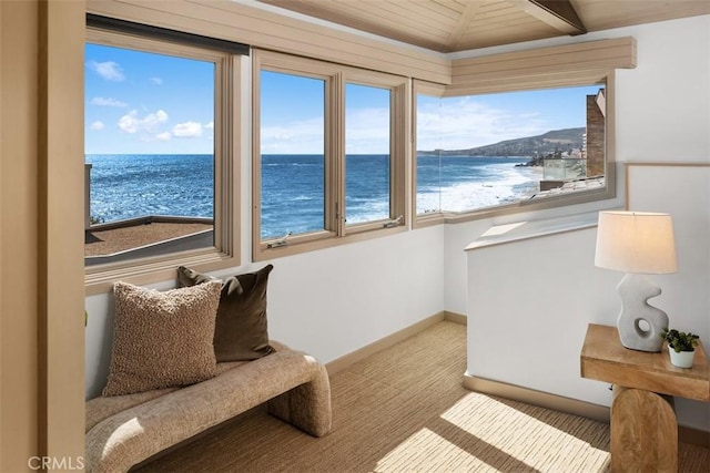 1907 Ocean Way, Laguna Beach, CA 92651 - sitting room featuring a water view, plenty of natural light, wood ceiling, carpet flooring, and baseboards