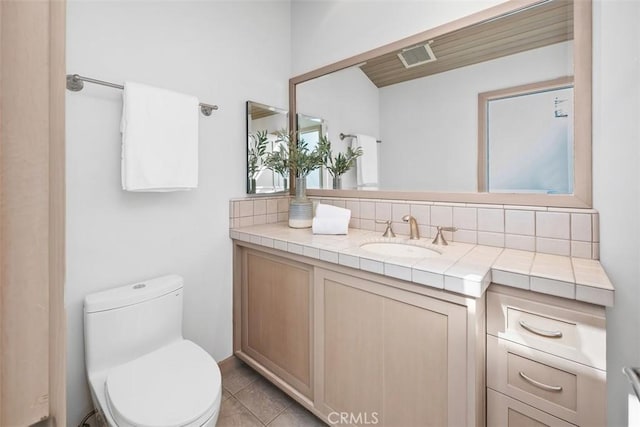 1907 Ocean Way, Laguna Beach, CA 92651 - half bath featuring toilet, vanity, backsplash, and tile patterned floors