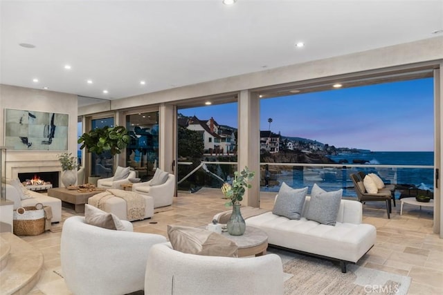 1907 Ocean Way, Laguna Beach, CA 92651 - living room featuring a lit fireplace, recessed lighting, and stone finish floors
