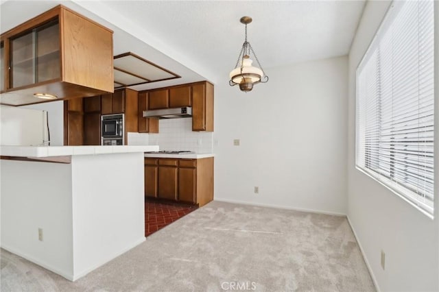 4515 Alla Rd Unit 2, Marina Del Rey, CA 90292 - kitchen featuring black microwave, under cabinet range hood, carpet floors, brown cabinets, and freestanding refrigerator