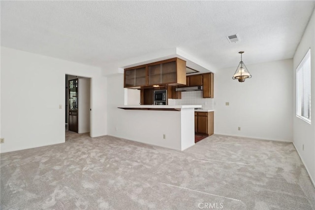 4515 Alla Rd Unit 2, Marina Del Rey, CA 90292 - kitchen with built in microwave, light carpet, light countertops, open floor plan, and a peninsula