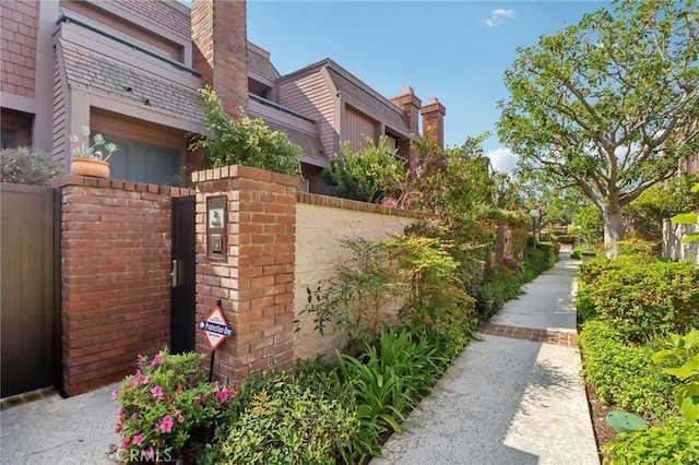 4515 Alla Rd Unit 2, Marina Del Rey, CA 90292 - view of side of property featuring a gate and a chimney