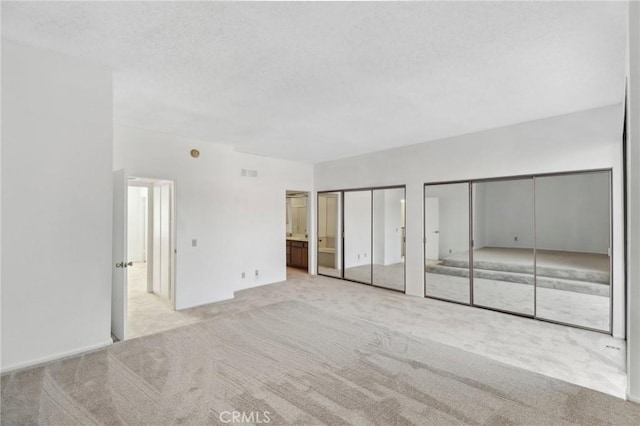 4515 Alla Rd Unit 2, Marina Del Rey, CA 90292 - unfurnished bedroom featuring carpet flooring, multiple closets, and ensuite bath