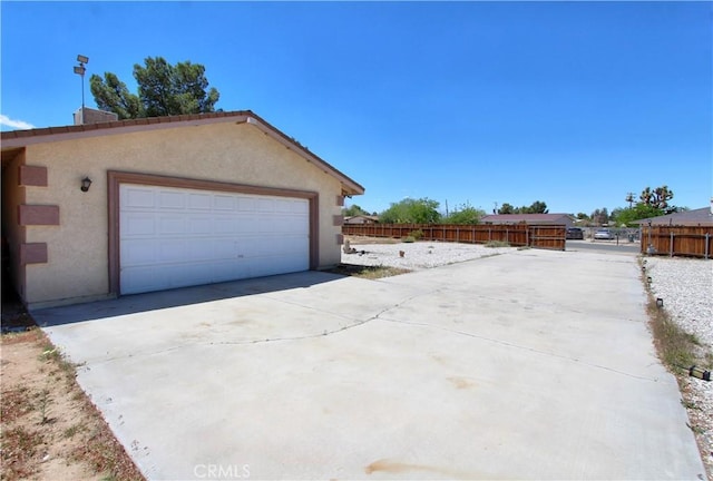 garage with fence