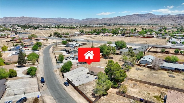 aerial view of residential area featuring a mountain backdrop