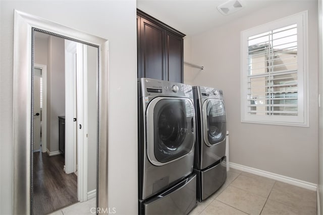 29048 N W Hills Dr, Valencia, CA 91354 - laundry room featuring washer and clothes dryer, cabinet space, and light tile patterned flooring