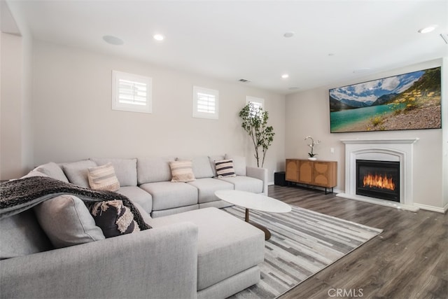 29048 N W Hills Dr, Valencia, CA 91354 - living area featuring wood finished floors, a glass covered fireplace, and recessed lighting