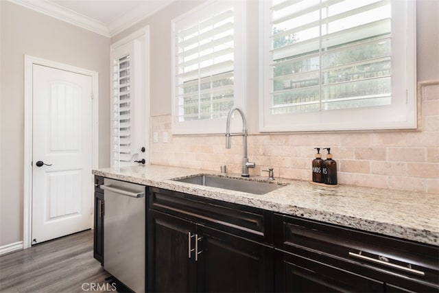 29048 N W Hills Dr, Valencia, CA 91354 - kitchen featuring dishwasher, ornamental molding, wood finished floors, backsplash, and dark cabinetry
