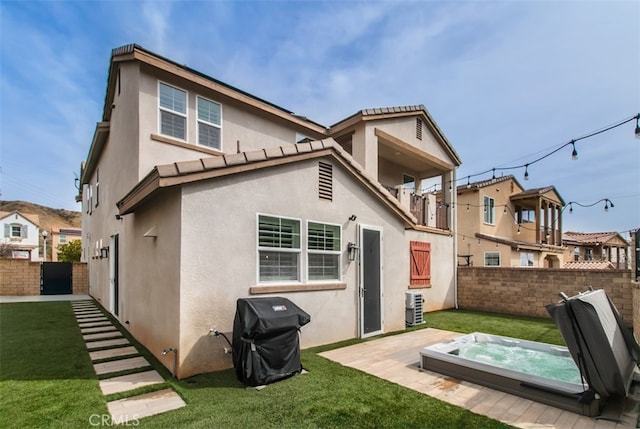 29048 N W Hills Dr, Valencia, CA 91354 - back of house featuring an outdoor hot tub and stucco siding