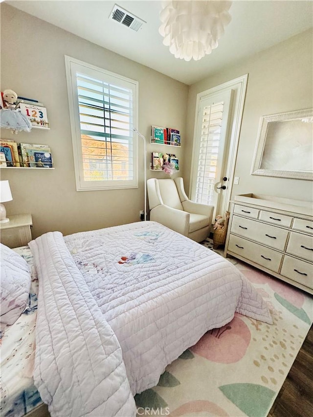 29048 N W Hills Dr, Valencia, CA 91354 - bedroom featuring wood finished floors and a chandelier