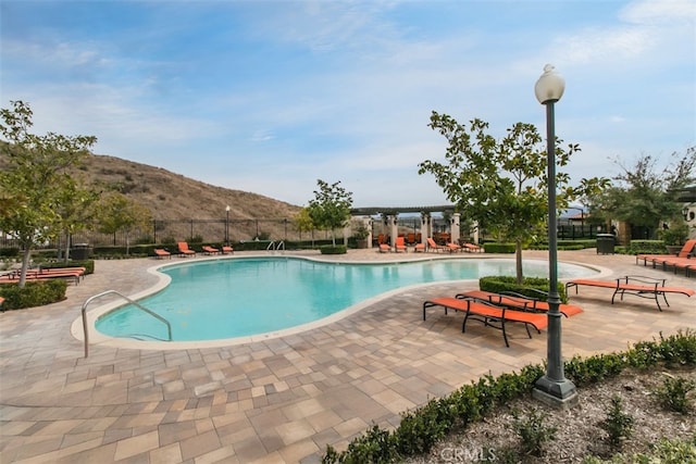 29048 N W Hills Dr, Valencia, CA 91354 - community pool featuring a mountain view and a patio