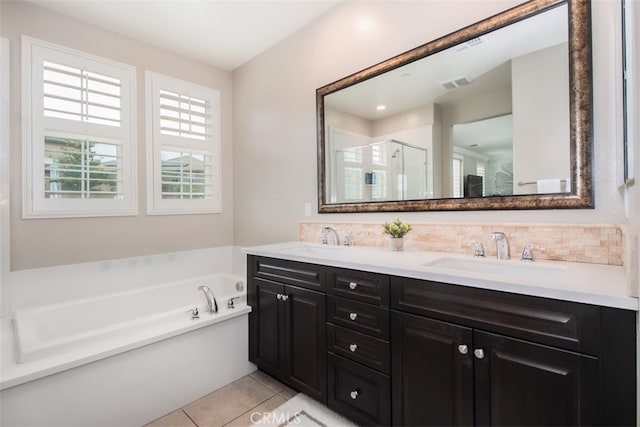 29048 N W Hills Dr, Valencia, CA 91354 - bathroom with double vanity, a bath, a stall shower, tile patterned flooring, and decorative backsplash
