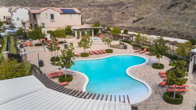 29048 N W Hills Dr, Valencia, CA 91354 - community pool with a patio area and a pergola