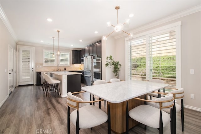 29048 N W Hills Dr, Valencia, CA 91354 - dining room with dark wood-type flooring, ornamental molding, recessed lighting, and a chandelier