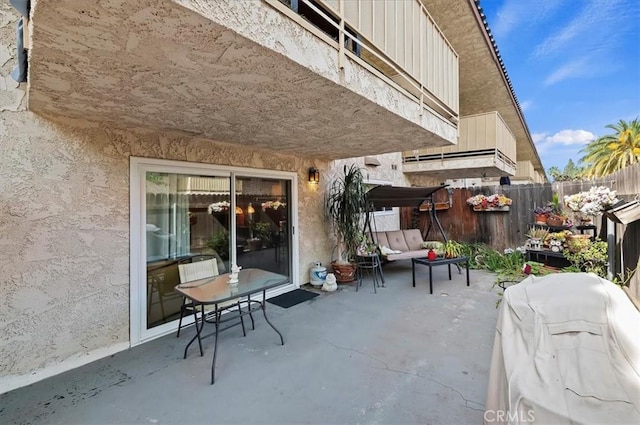 view of patio / terrace featuring a fenced backyard and an outdoor living space