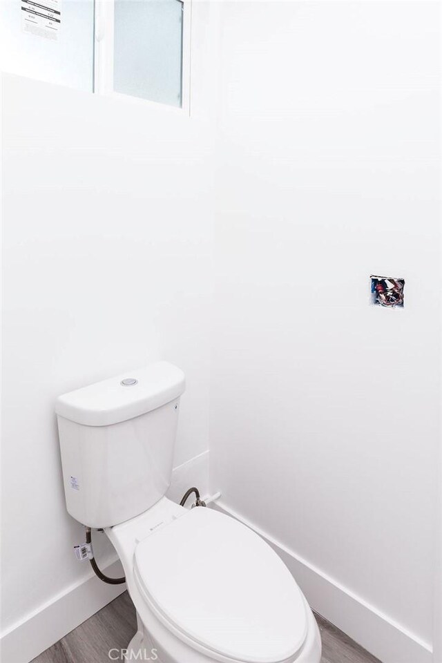 4401 La Clede Ave, Los Angeles, CA 90039 - bathroom featuring wood finished floors, baseboards, and toilet