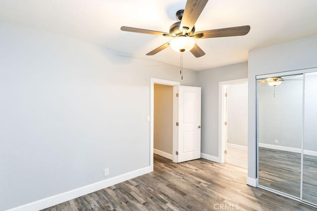 4401 La Clede Ave, Los Angeles, CA 90039 - unfurnished bedroom featuring wood finished floors, baseboards, a closet, and ceiling fan