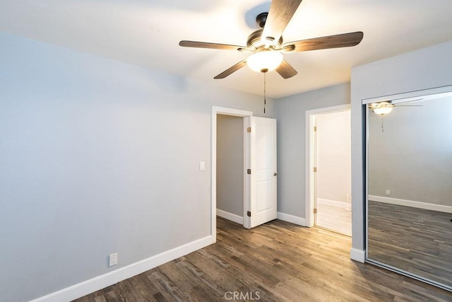 4401 La Clede Ave, Los Angeles, CA 90039 - unfurnished bedroom featuring wood finished floors, baseboards, a ceiling fan, and a closet