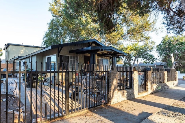 4401 La Clede Ave, Los Angeles, CA 90039 - view of front of home featuring a fenced front yard, stucco siding, and a gate