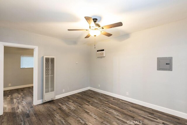 4401 La Clede Ave, Los Angeles, CA 90039 - empty room with electric panel, a ceiling fan, dark wood-style floors, a heating unit, and baseboards