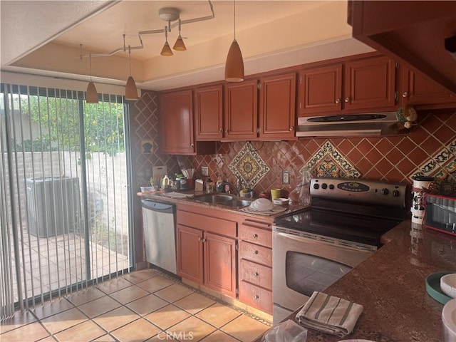 5334 Los Coyotes Dr, Palm Springs, CA 92264 - kitchen with range hood, appliances with stainless steel finishes, a sink, and decorative backsplash