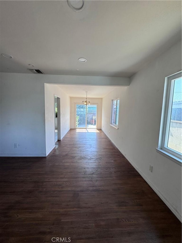15407 S Visalia Ave, Compton, CA 90220 - unfurnished living room with a chandelier, dark wood-style floors, baseboards, and recessed lighting