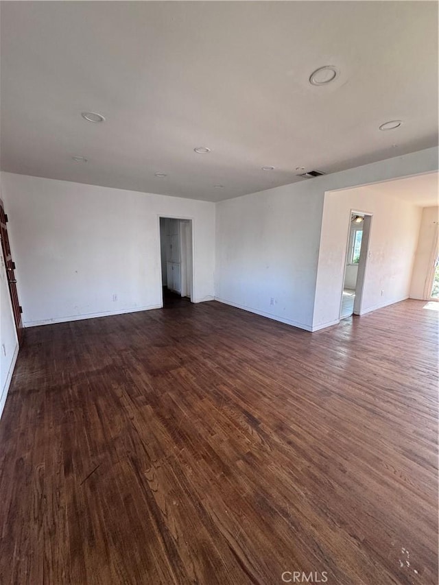 15407 S Visalia Ave, Compton, CA 90220 - spare room featuring dark wood-type flooring and baseboards
