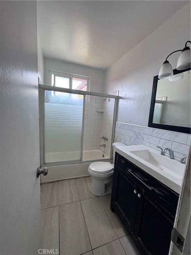 15407 S Visalia Ave, Compton, CA 90220 - full bath featuring toilet, bath / shower combo with glass door, and vanity