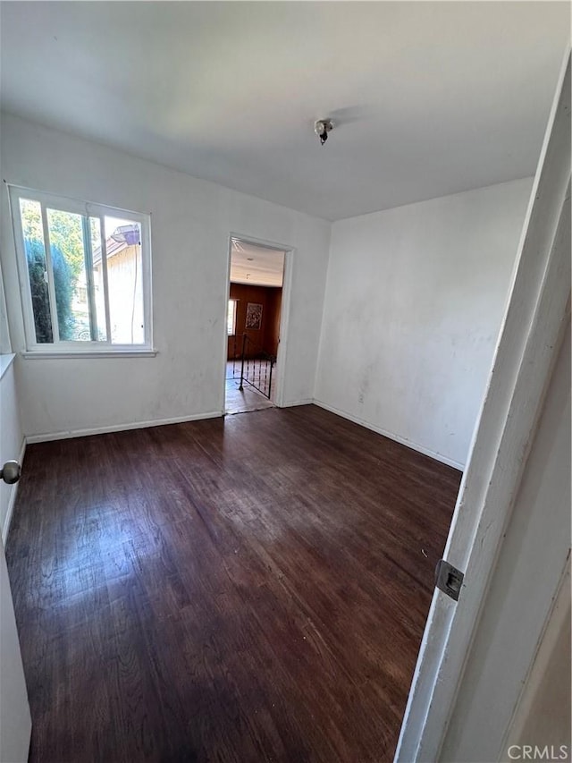 15407 S Visalia Ave, Compton, CA 90220 - empty room with wood finished floors and baseboards