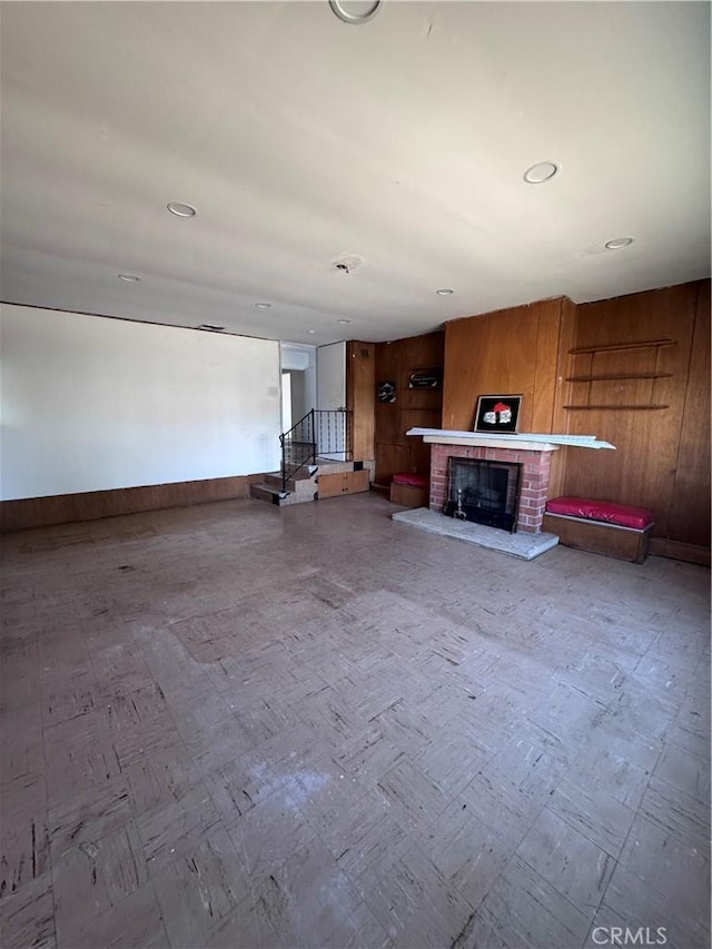 15407 S Visalia Ave, Compton, CA 90220 - unfurnished living room with a brick fireplace, baseboards, and recessed lighting