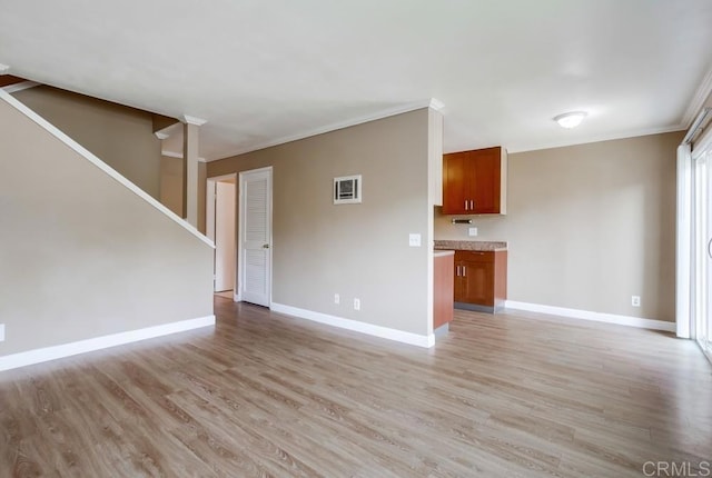 8102 Winter Gardens Blvd Unit 2, Lakeside, CA 92040 - unfurnished living room featuring light wood-style flooring, crown molding, and stairs