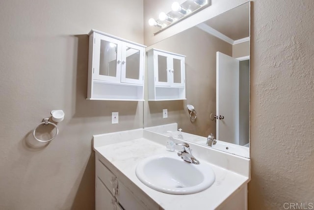 8102 Winter Gardens Blvd Unit 2, Lakeside, CA 92040 - bathroom with vanity, a textured wall, and crown molding