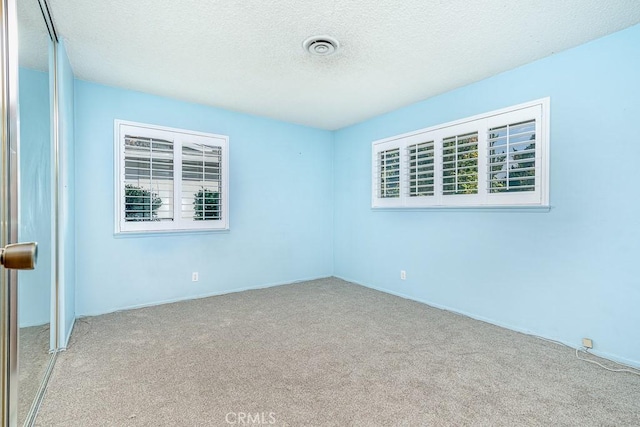 43451 Briercliff Dr, Hemet, CA 92544 - carpeted spare room with a textured ceiling and baseboards