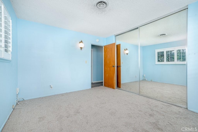43451 Briercliff Dr, Hemet, CA 92544 - unfurnished bedroom with carpet flooring, a closet, and a textured ceiling