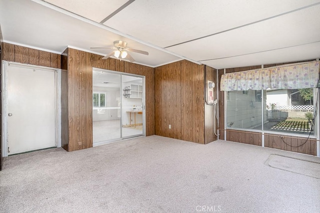43451 Briercliff Dr, Hemet, CA 92544 - carpeted spare room with a ceiling fan and wood walls