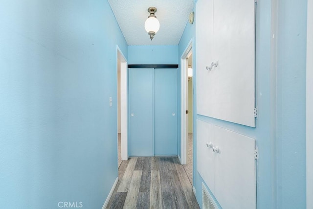 43451 Briercliff Dr, Hemet, CA 92544 - doorway featuring wood finished floors and a textured ceiling