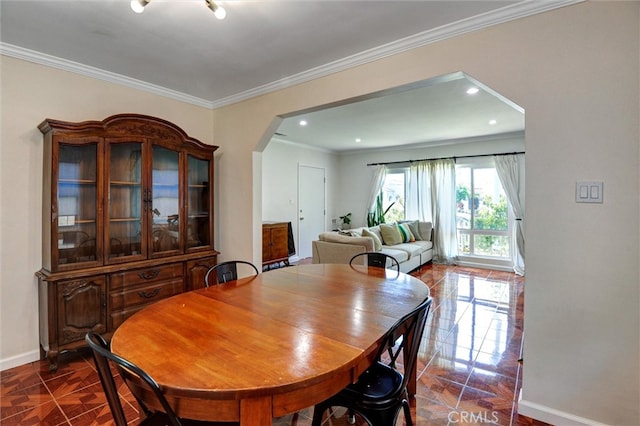 5864 Bonsallo Ave, Los Angeles, CA 90044 - dining room featuring arched walkways, baseboards, ornamental molding, and recessed lighting