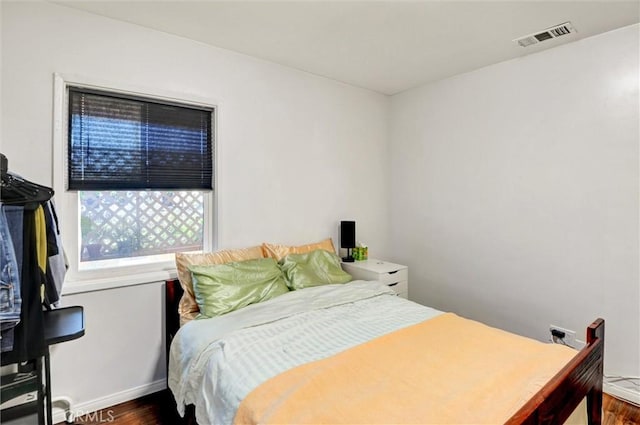 5864 Bonsallo Ave, Los Angeles, CA 90044 - bedroom featuring wood finished floors and baseboards