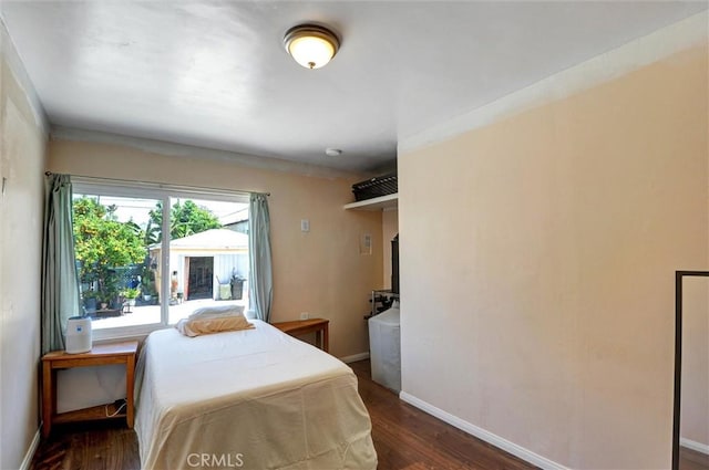 5864 Bonsallo Ave, Los Angeles, CA 90044 - bedroom featuring dark wood finished floors and baseboards