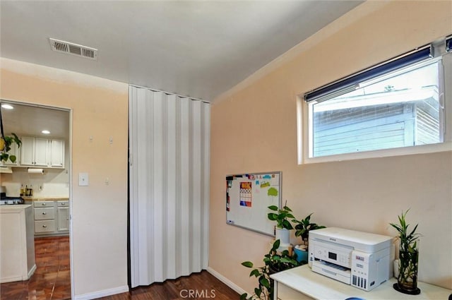 5864 Bonsallo Ave, Los Angeles, CA 90044 - sitting room featuring dark wood-style flooring and baseboards