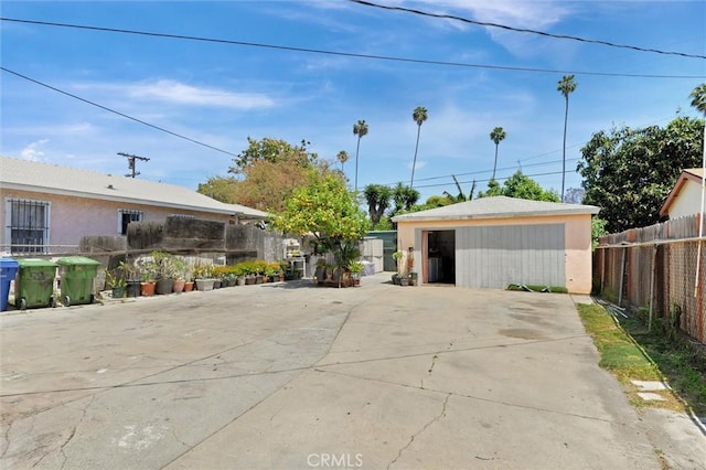 5864 Bonsallo Ave, Los Angeles, CA 90044 - exterior space with an outdoor structure and a detached garage