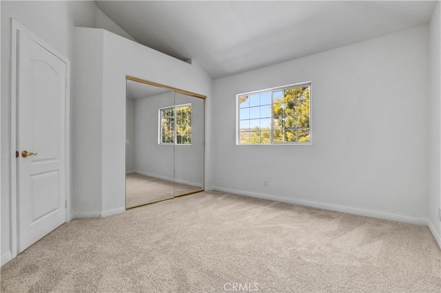 4064 Lemonberry Pl, Thousand Oaks, CA 91362 - unfurnished bedroom featuring carpet, vaulted ceiling, baseboards, and a closet