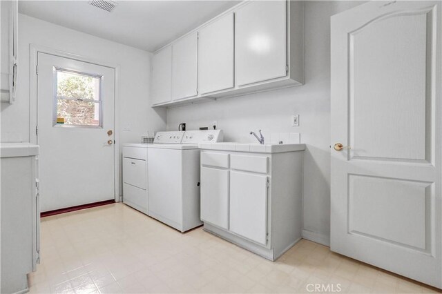 4064 Lemonberry Pl, Thousand Oaks, CA 91362 - laundry area featuring washing machine and clothes dryer, cabinet space, and light floors